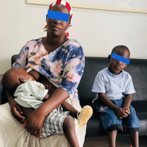 Arthur with his mother, Ms. Nakibuule Proscovia and his little sibling.
