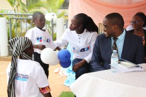 Mohammad, one of the beneficiaries of the free cleft lip and palate surgeries, alongside his mother, expressing gratitude and appreciation to Audrey Linda and Dr. Nicholas Mugagga for their support.